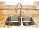 Stainless steel sink with a pull-down faucet and granite countertops at 2872 Dreamcatcher Loop, Castle Rock, CO 80109