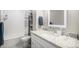 Bright bathroom with white subway tile, granite countertop, and a modern vanity at 15107 E Wesley Ave, Aurora, CO 80014