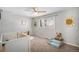 Bright bedroom with natural light, playful decor, and neutral walls at 15107 E Wesley Ave, Aurora, CO 80014