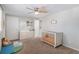 Comfortable Bedroom features light-colored walls, changing table and plenty of space at 15107 E Wesley Ave, Aurora, CO 80014