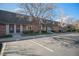 Brick townhomes feature well-manicured lawns and parking spaces for residents and visitors at 15107 E Wesley Ave, Aurora, CO 80014