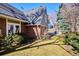 Well-maintained backyard featuring lush lawn and a charming brick house exterior at 210 S High St, Denver, CO 80209