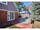 Backyard with brick patio and comfortable outdoor seating, ideal for enjoying the outdoors at 210 S High St, Denver, CO 80209
