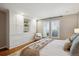 Bedroom featuring built-in storage and light-filled windows with plantation shutters at 210 S High St, Denver, CO 80209