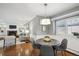 Dining area with hardwood floors, modern lighting, and stylish decor at 210 S High St, Denver, CO 80209