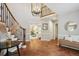 Grand foyer featuring tiled flooring, elegant staircase with wrought iron railings, and views into the living spaces at 210 S High St, Denver, CO 80209