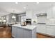 Modern kitchen with white cabinets, quartz countertops, and stainless steel appliances at 210 S High St, Denver, CO 80209