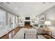 Cozy living room with fireplace, built-in shelves, and french doors at 210 S High St, Denver, CO 80209