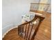 An elegant staircase with decorative iron spindles and hardwood steps, leading to the home's living areas at 210 S High St, Denver, CO 80209