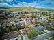 Expansive aerial view of a charming residential area with lush greenery and the beautiful backdrop of rolling hills at 14072 W Alaska Dr, Lakewood, CO 80228