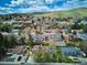 Stunning aerial view of a residential neighborhood nestled in the foothills with picturesque mountain views at 14072 W Alaska Dr, Lakewood, CO 80228
