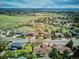 Breathtaking aerial view of a suburban community blending into a sprawling green landscape, offering serenity and space at 14072 W Alaska Dr, Lakewood, CO 80228