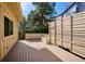 Relaxing back deck includes wood flooring and a stylish privacy fence with bench at 14072 W Alaska Dr, Lakewood, CO 80228