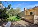 Well-maintained back yard with lush lawn and a custom deck, great for relaxing outdoors at 14072 W Alaska Dr, Lakewood, CO 80228