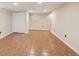 Large basement storage area with tiled floor, great for storage and organization at 14072 W Alaska Dr, Lakewood, CO 80228