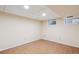Bright basement area with tile floors, neutral walls, and ample lighting at 14072 W Alaska Dr, Lakewood, CO 80228