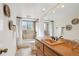 The bathroom features a combined tub and shower with earth-toned tile and earth-toned countertop at 14072 W Alaska Dr, Lakewood, CO 80228