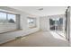 Spacious bedroom featuring natural light, carpeted floors, and a sliding glass door to a balcony at 14072 W Alaska Dr, Lakewood, CO 80228