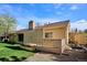 Exterior view of home featuring spacious deck, landscaped yard, and beautiful backyard at 14072 W Alaska Dr, Lakewood, CO 80228