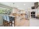 Charming kitchen with stainless steel appliances, granite countertops, and light wood cabinets at 14072 W Alaska Dr, Lakewood, CO 80228