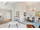 Open-concept space combines living and dining areas with high ceilings, ample light, and modern furnishings at 14072 W Alaska Dr, Lakewood, CO 80228