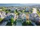 A beautiful aerial view of a suburban neighborhood with well-maintained homes and green spaces at 651 Tiger Lily Way, Highlands Ranch, CO 80126
