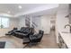Basement featuring theater seating, modern wet bar, and staircase at 651 Tiger Lily Way, Highlands Ranch, CO 80126
