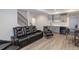 Finished basement featuring a wet bar, comfortable seating, and modern design at 651 Tiger Lily Way, Highlands Ranch, CO 80126