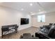 Finished basement featuring theater seating, sleek wet bar and neutral color palette at 651 Tiger Lily Way, Highlands Ranch, CO 80126
