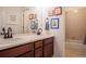 Bathroom features a double vanity and a shower-tub combo for convenience at 651 Tiger Lily Way, Highlands Ranch, CO 80126