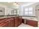 Bathroom featuring dual sinks, a soaking tub, and a glass shower at 651 Tiger Lily Way, Highlands Ranch, CO 80126