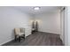 A bright bedroom features gray floors, white walls, closet and ceiling light at 651 Tiger Lily Way, Highlands Ranch, CO 80126