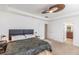 Main bedroom with tray ceiling, and bright, natural light. Includes access to bathroom and closet at 651 Tiger Lily Way, Highlands Ranch, CO 80126