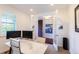 Bright office space featuring white french doors, two monitors, and a marble desk at 651 Tiger Lily Way, Highlands Ranch, CO 80126
