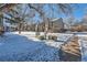 Landscaped yard with pathway and snow cover at 3576 S Depew St # 104, Lakewood, CO 80235