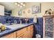 Bathroom boasts blue tile and a large vanity at 3576 S Depew St # 104, Lakewood, CO 80235