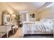 Charming bedroom with a queen-size bed and vanity at 3576 S Depew St # 104, Denver, CO 80235