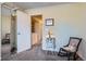 Bedroom with mirrored closet and laundry access at 3576 S Depew St # 104, Denver, CO 80235