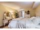 Charming bedroom with a queen-size bed and vanity at 3576 S Depew St # 104, Denver, CO 80235