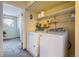 Convenient laundry room with washer and dryer at 3576 S Depew St # 104, Lakewood, CO 80235