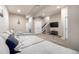 Finished basement featuring neutral paint, cozy carpet, and a large sectional sofa with stairs at 1928 W 67Th Pl, Denver, CO 80221