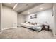 Finished basement featuring neutral paint, cozy carpet, and a large sectional sofa for relaxation and entertainment at 1928 W 67Th Pl, Denver, CO 80221