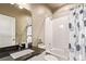 Bathroom featuring a tub shower combination, a large sink, and neutral colors at 1928 W 67Th Pl, Denver, CO 80221