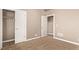 Bedroom featuring plush carpet and multiple doorways leading to closet and other spaces at 1928 W 67Th Pl, Denver, CO 80221