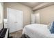 Comfortable bedroom features a plush bed and closet space for storage at 1928 W 67Th Pl, Denver, CO 80221