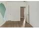 Bedroom boasting hardwood floors and two doors, including one to a large closet at 1928 W 67Th Pl, Denver, CO 80221