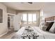Bedroom featuring natural light and decorative throw blanket at 1928 W 67Th Pl, Denver, CO 80221
