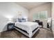 Cozy bedroom with a plush bed, soft lighting, and ample space, perfect for relaxation at 1928 W 67Th Pl, Denver, CO 80221