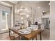 Cozy dining area with modern lighting, table setting, and open layout at 1928 W 67Th Pl, Denver, CO 80221