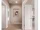 Hallway with hardwood floors and stylish wall decor at 1928 W 67Th Pl, Denver, CO 80221